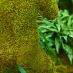 moss-covered mannequin